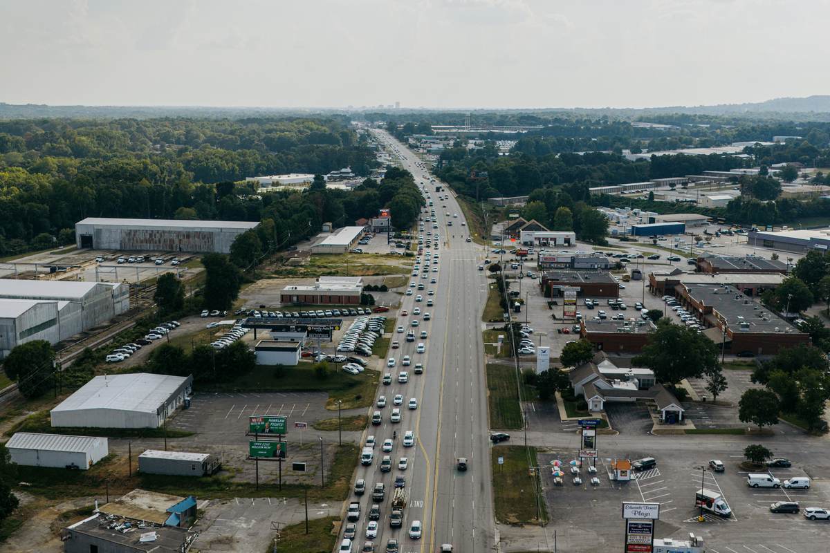 Traffic queued in one direction along Wade Hampton Boulevard in Taylors, seen from the air on an overcast afternoon.